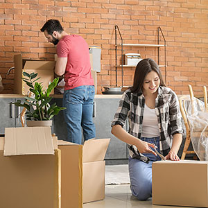 Couple unpacking from a move to the city