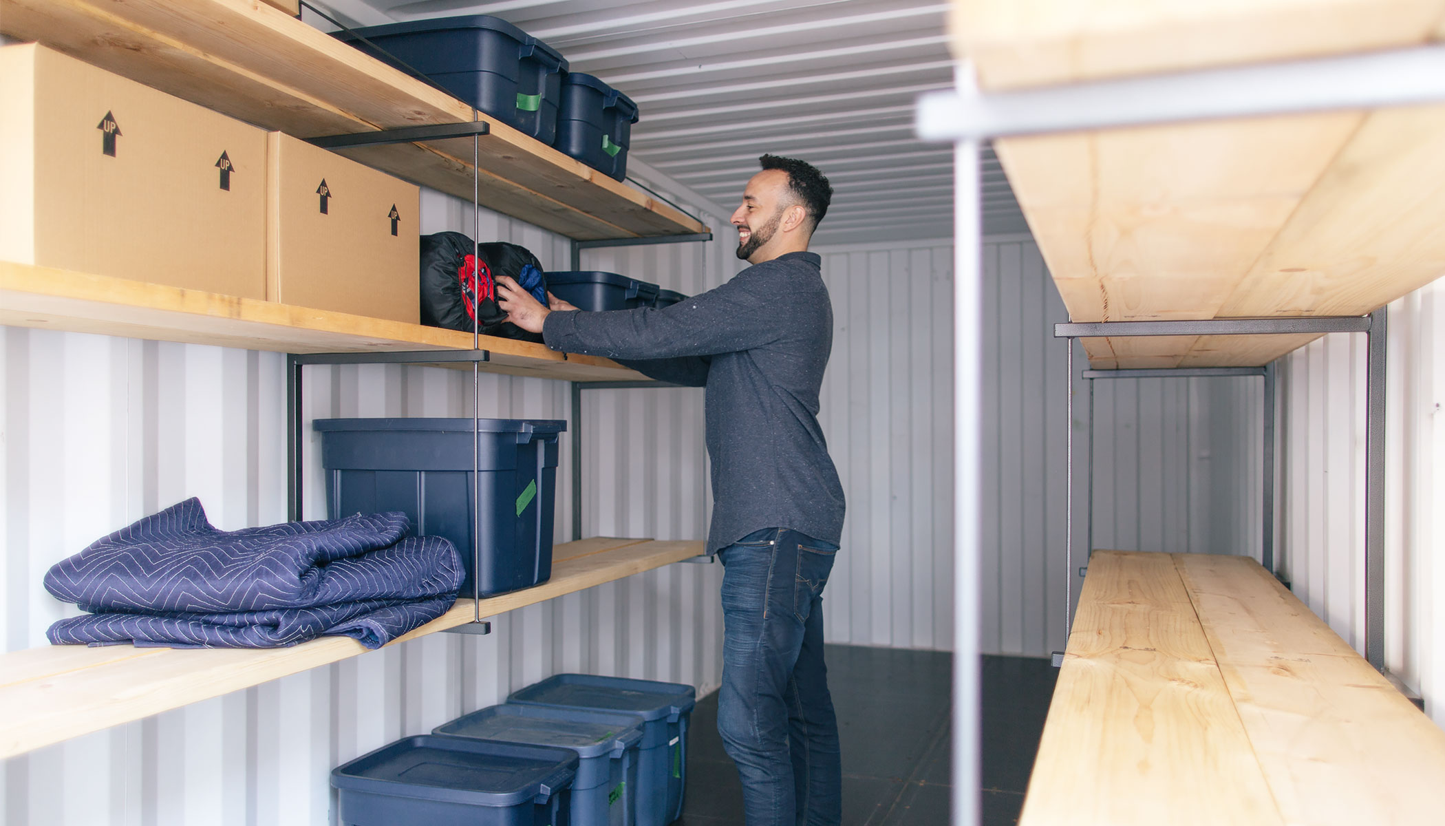 Man packing a portable storage container - BigSteelBox